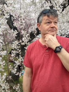 Dad looking pensive by some cherry blossom